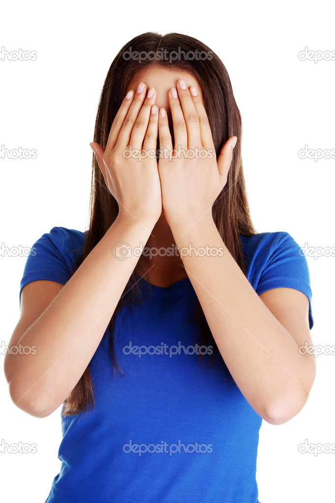 Teen woman covering her face