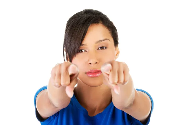 Beautifl young woman pointing on somebody with pointing fingers. — Stock Photo, Image