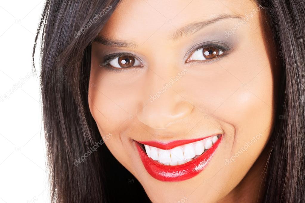 Beautiful woman's smiling face with red lipstick.