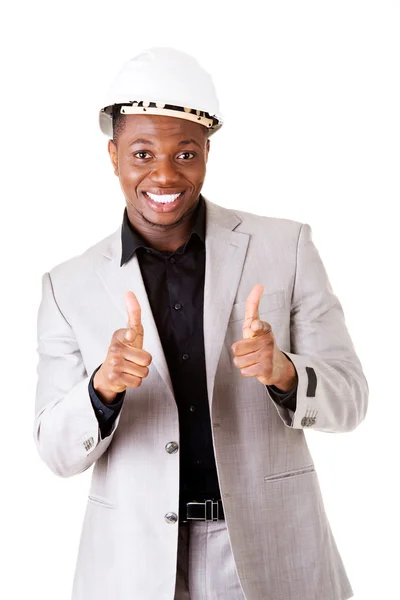 Male businessman wearing a helmet. Pointing. — Stock Photo, Image