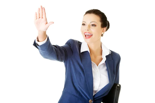 Attractive business woman with hand up looking. — Stock Photo, Image