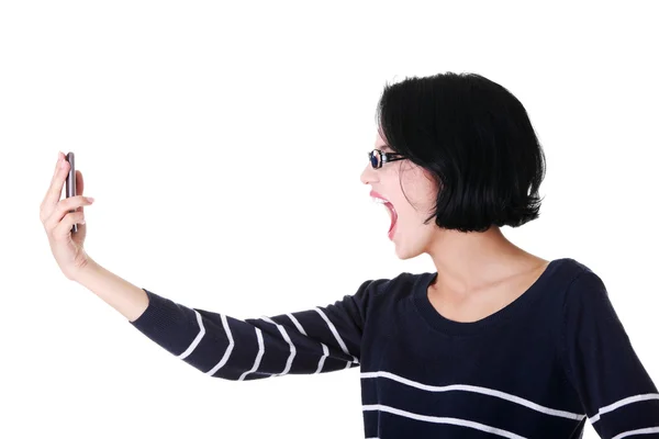 Attractive woman shouting to the phone. — Stock Photo, Image