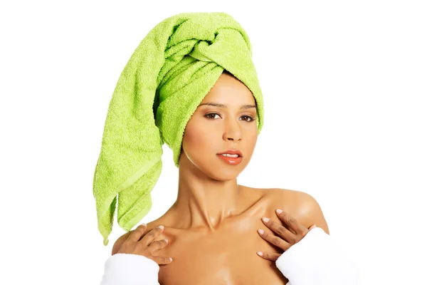 Attractive woman wrapped in towel with turban. — Stock Photo, Image