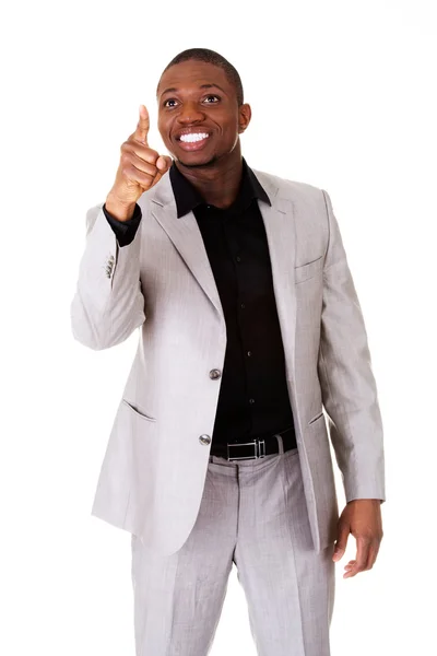 Male businessman poiting high in a smile. — Stock Photo, Image