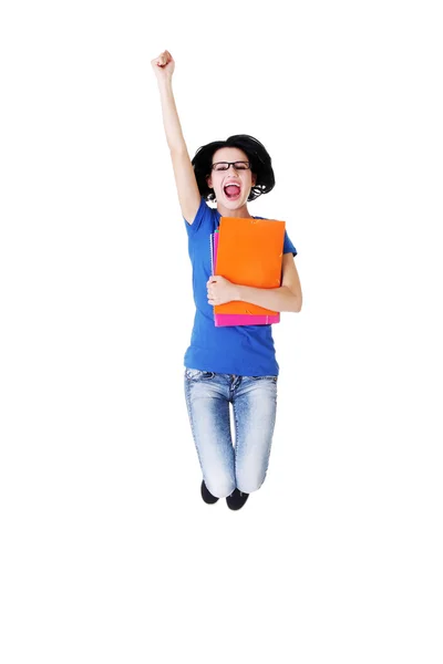 Attractive woman with files jumping. Showing fists, OK. — Stock Photo, Image