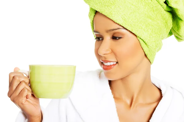 Attractive woman wrapped in towel with turban on head — Stock Photo, Image