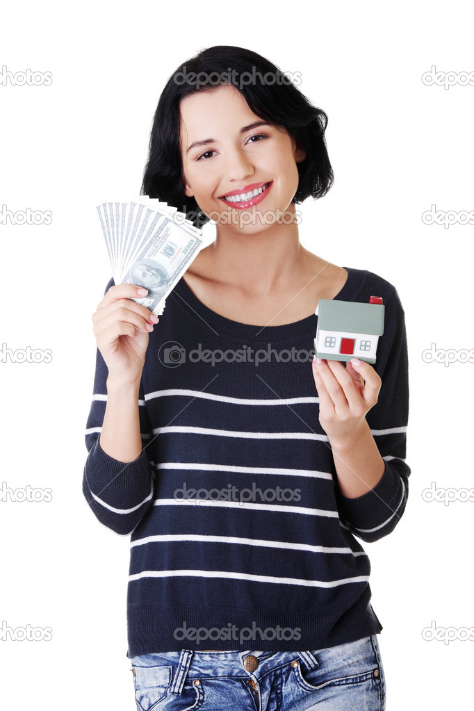 Attractive girl with money and house on hands.