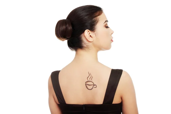 Attractive woman with coffee cup painted on her back. — Stock Photo, Image