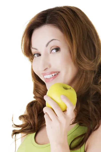 Atractiva mujer casual sosteniendo una manzana . —  Fotos de Stock