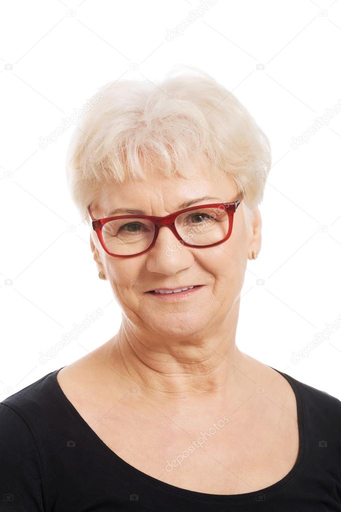 Portrait of an old woman in eyeglasses.