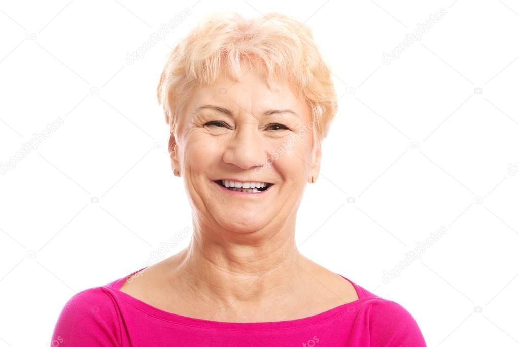 Portrait of an old woman in pink shirt.