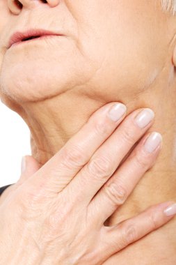 Close up on older woman's hand holding neck. clipart