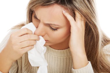 Young woman with tissues crying or having runny nose. clipart