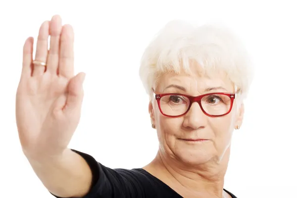 An old lady showing stop sign by hand. — Stock Photo, Image