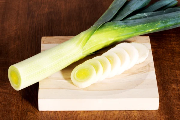 Green fresh leek on cutting board. — Stock Photo, Image