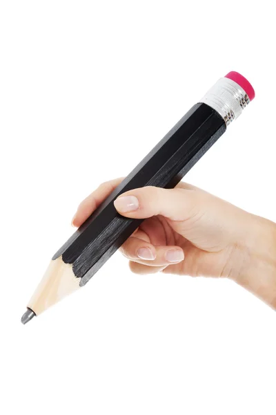 Woman's hand is holding big pencil and writing on copy space. — Stock Photo, Image