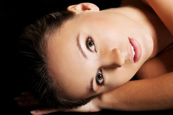 Naked woman lying on her belly. — Stock Photo, Image