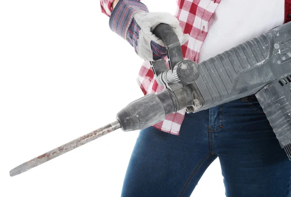 Casual vrouw bedrijf jackhammer. — Stockfoto