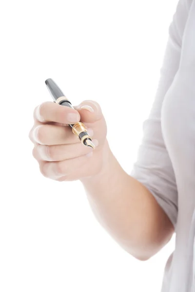 Close-up op een pen gehouden door een jonge zakenvrouw. — Stockfoto