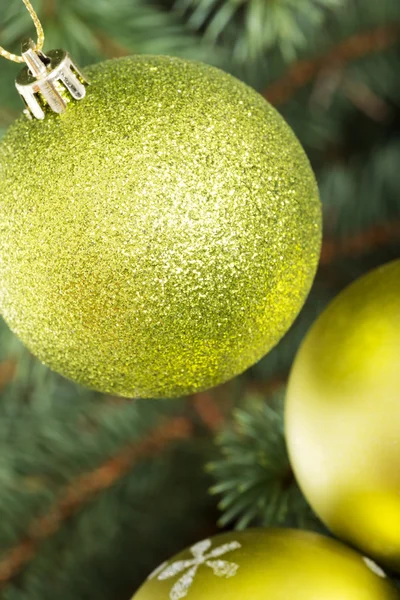 Three christmas balls hanging on christmas tree. — Stock Photo, Image