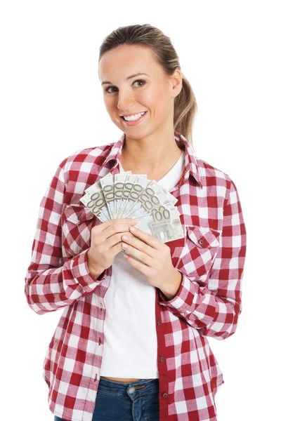 Mujer joven sosteniendo una gran suma de dinero . —  Fotos de Stock