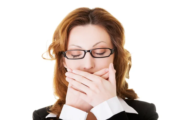 Attractive business woman with hands on her mouth. — Stock Photo, Image