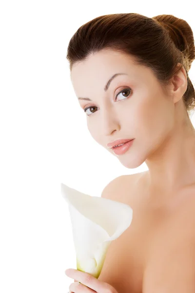 Portrait of beautiful adult woman with health skin and with lily Stock Photo