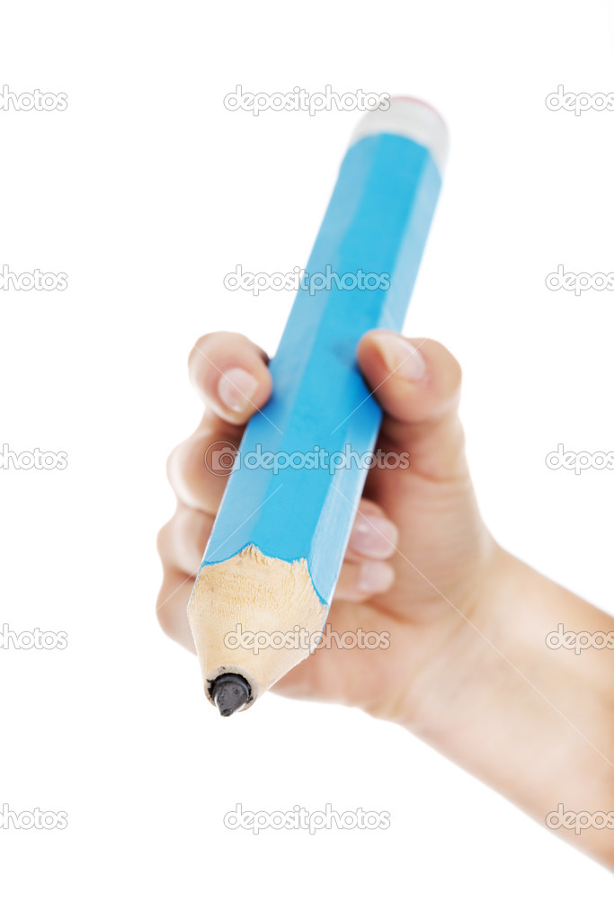 Woman's hand is holding big pencil and writing on copy space.