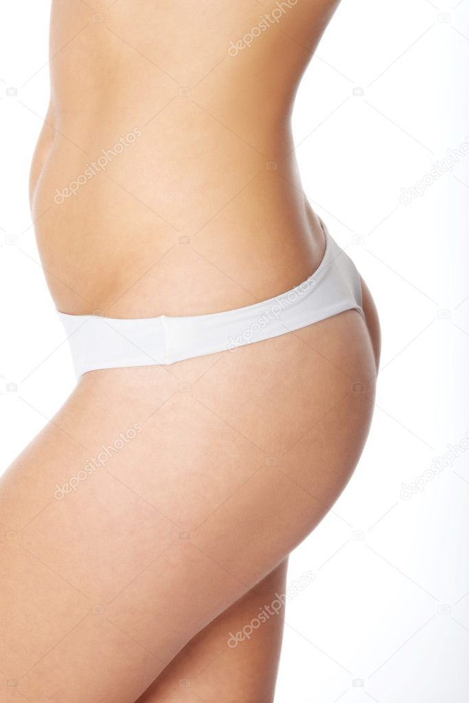 Female's slim buttocks in underwear.