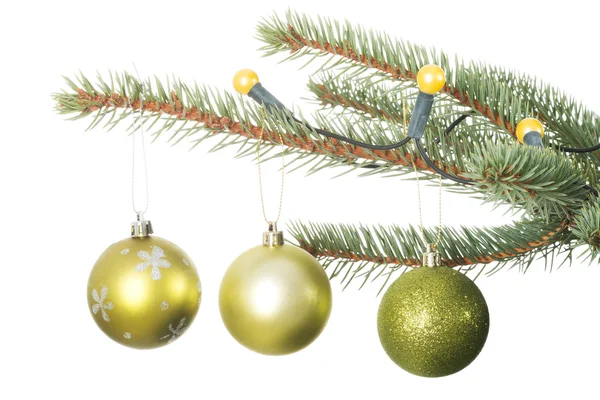 Three christmas balls hanging on a twig. — Stock Photo, Image