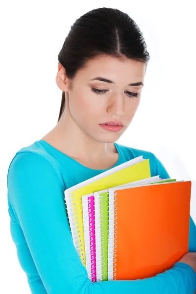Retrato de una joven estudiante triste con libro de trabajo . — Foto de Stock