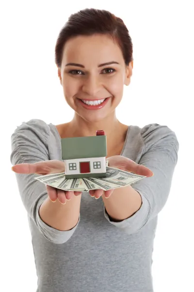 Young beautiful woman with money and house . — Stock Fotó