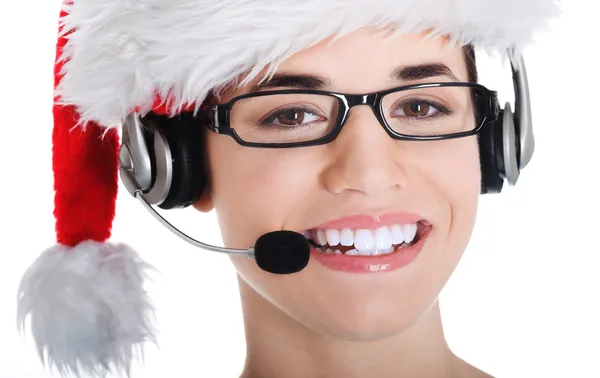 Portrait of woman in santa hat with microphone and headphone. — Stock Photo, Image