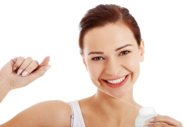 diş ipi ile güzel bir genç kadın.