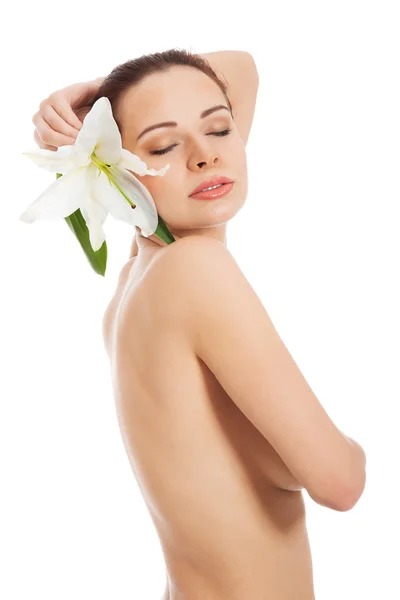 Beautiful topless woman with white lily. — Stock Photo, Image