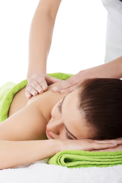 Beautiful woman lying on bed in spa salon. — Stock Photo, Image