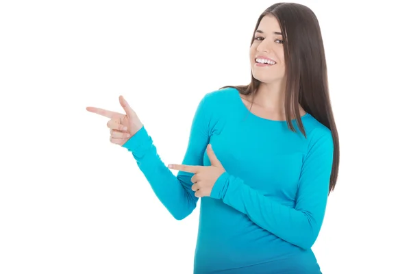 Beautiful casual woman pointing on copy space. — Stock Photo, Image