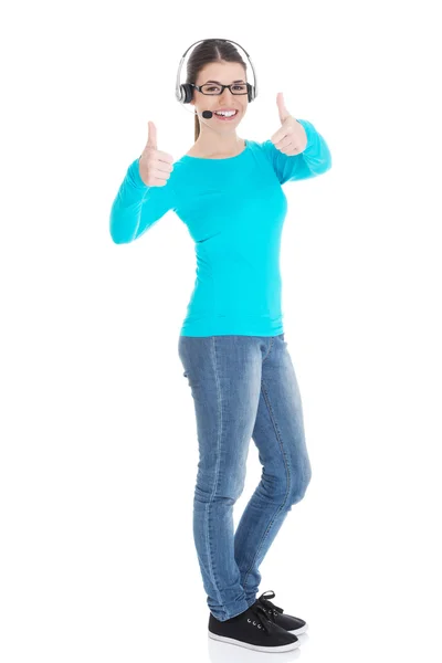 Young casual woman with headphones and microphone showing ok. — Stock Photo, Image