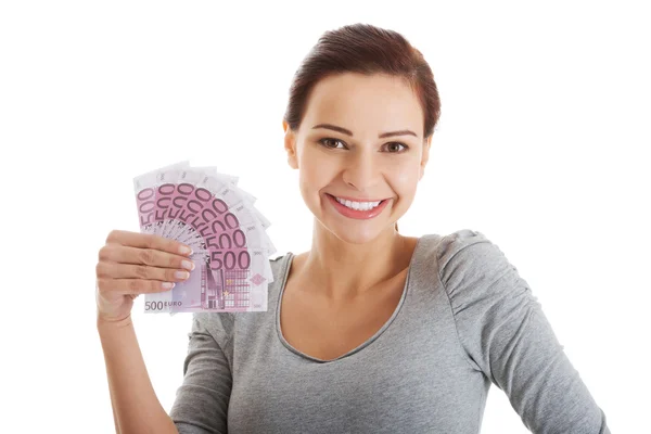 Hermosa mujer casual sosteniendo dinero . —  Fotos de Stock