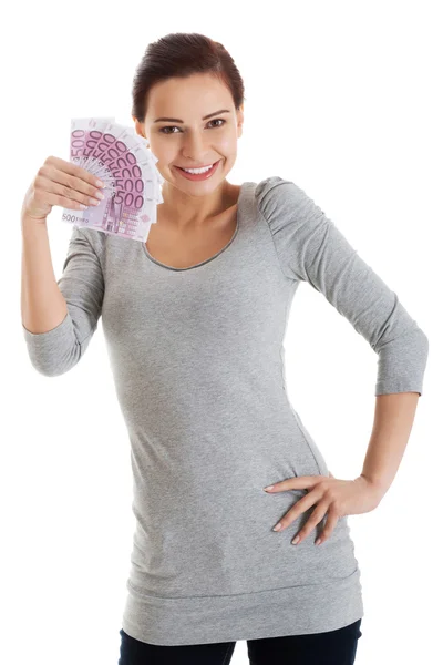 Beautiful casual woman holding money. — Stock Photo, Image