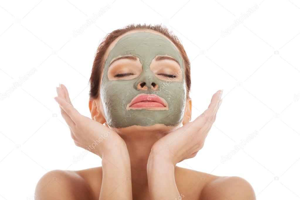 Beautifu toplessl woman with facial mask.