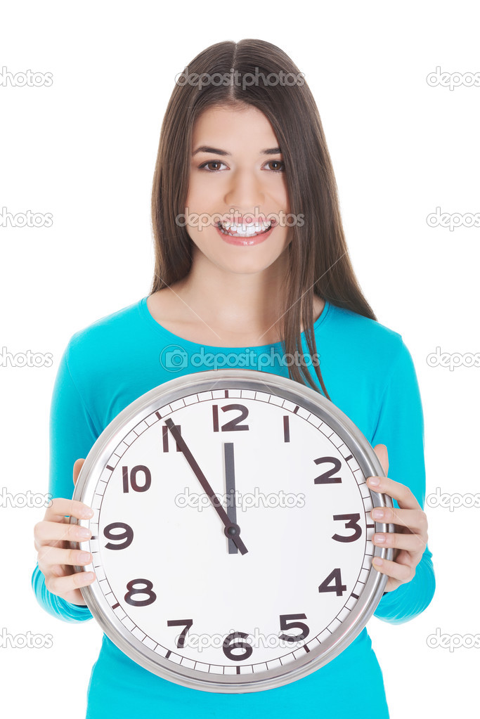 Young casual woman is holding a clock.