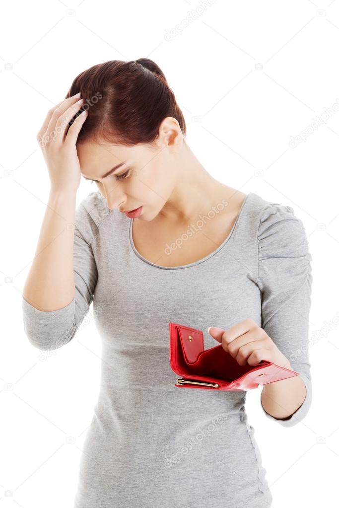 Beautiful casual woman with empty wallet, worrying.