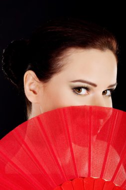 Beautiful woman in red sexy dress with fan. clipart