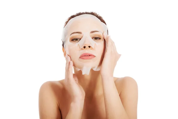 Beautiful spa woman with collagen mask. — Stock Photo, Image