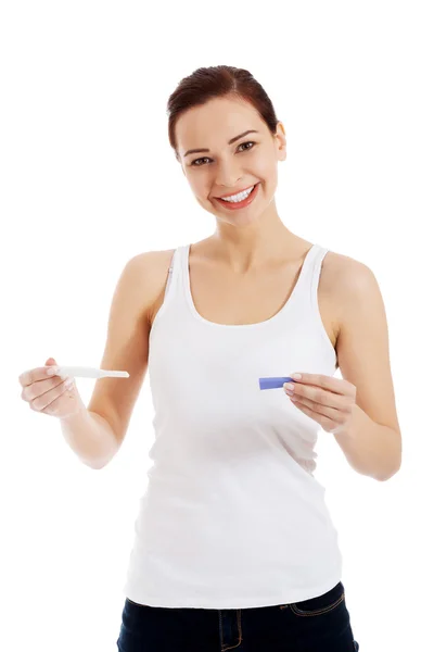 Happy beautiful young woman with pregnancy test. — Stock Photo, Image