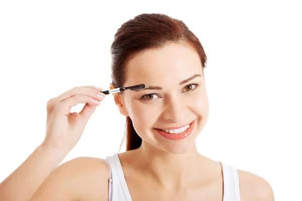 Schöne Hygiene-Frau mit Augenbürste. — Stockfoto