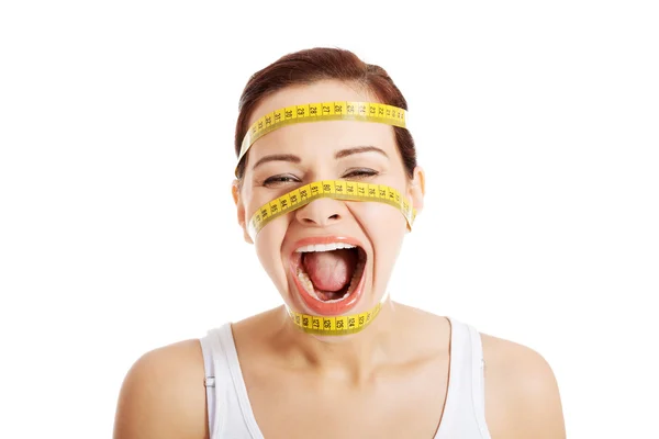 Krásná ženská tvář s měřicí páska. — Stock fotografie
