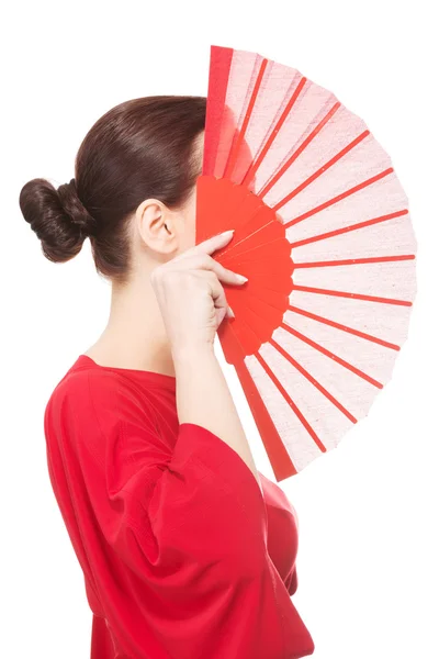 Beautiful woman in red sexy dress with fan. Stock Image