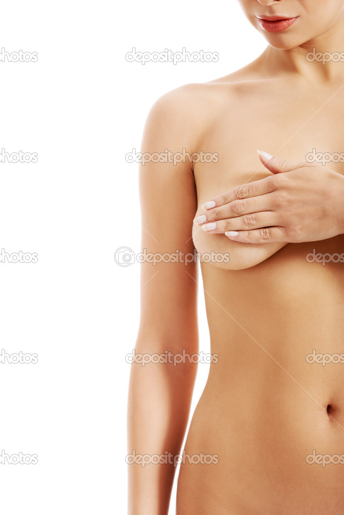 Naked beautiful woman holding her breast.